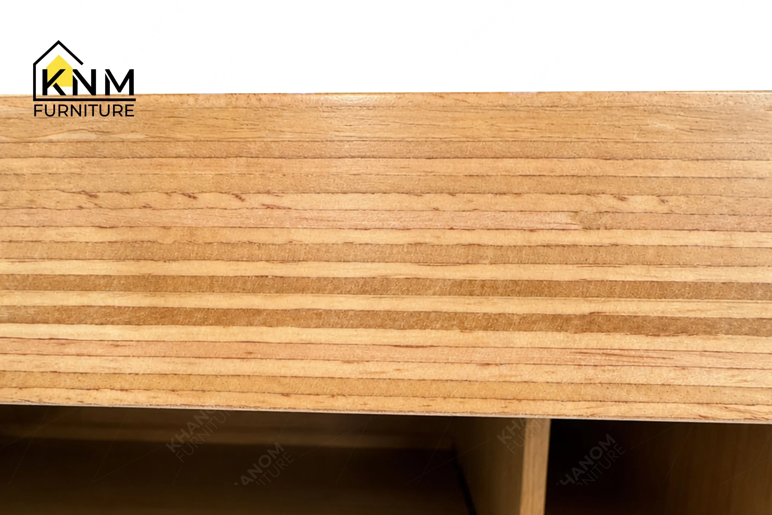 A technical detail of the laminate top oak veneer work table from Khanom Furniture, describing the aligned pull-out trays and oak cubbies.