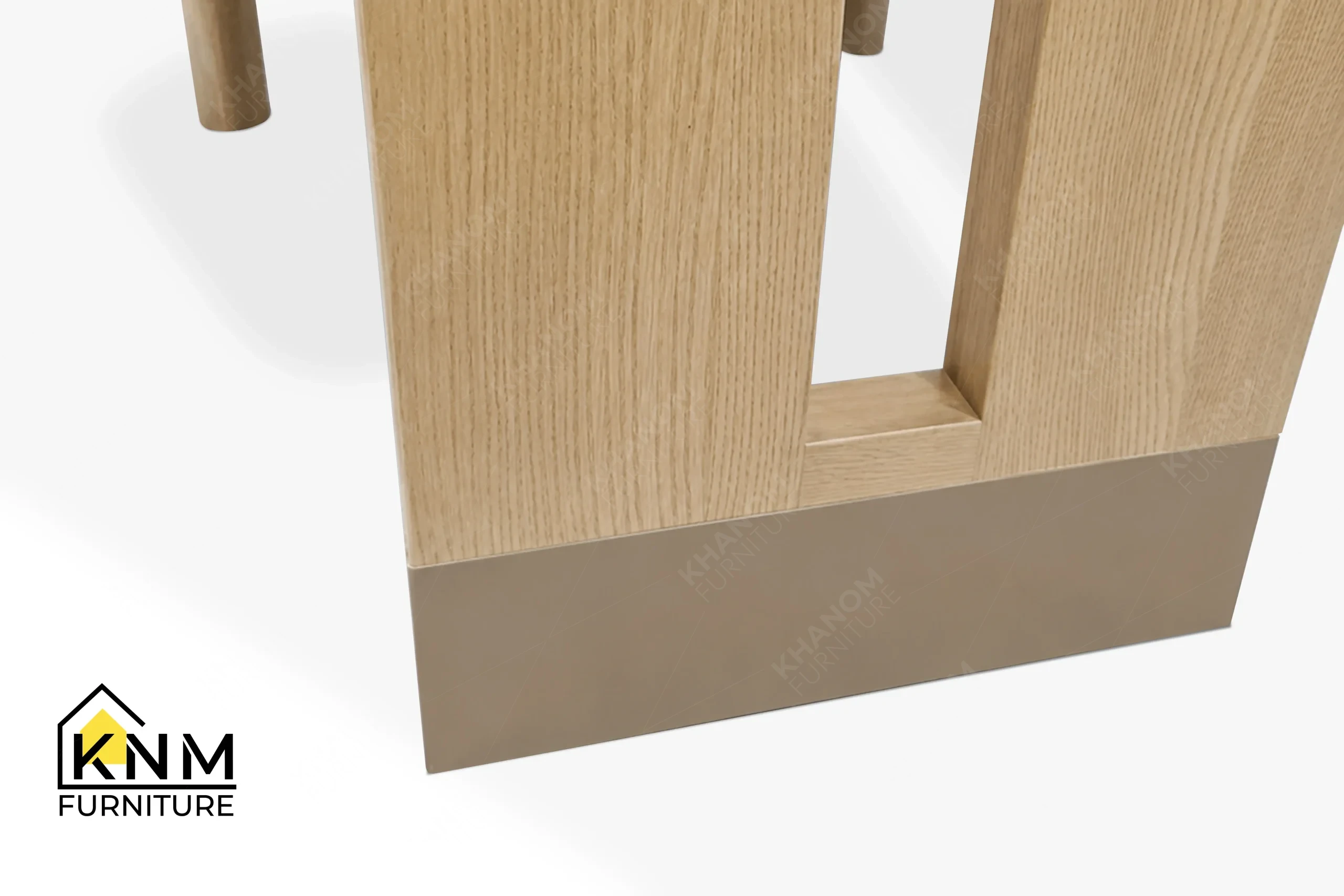 A technical detail of the metal sabot ash wood desk chair from Khanom Furniture, describing the Platinum Nickel sabot and the 1/16-inch reveal.