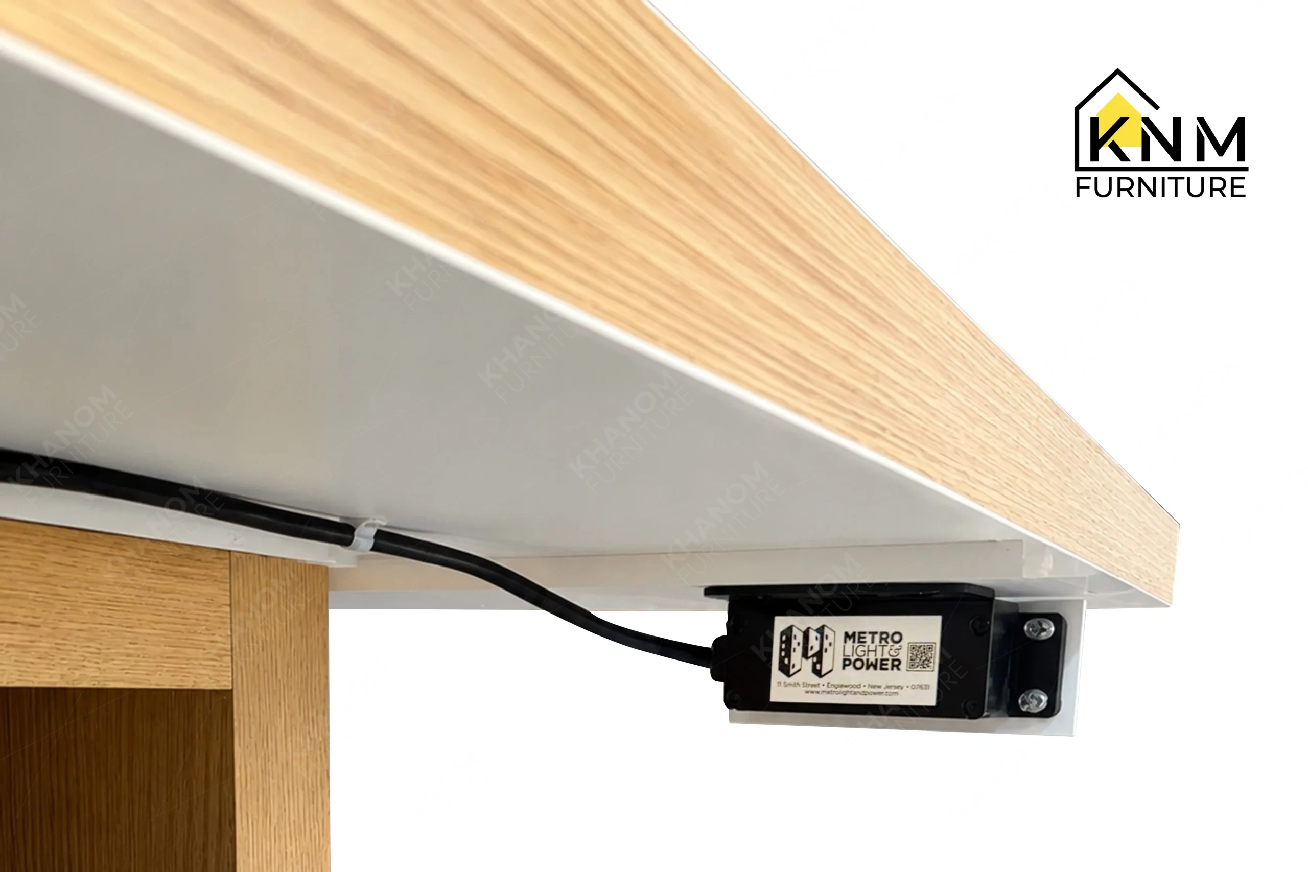 A technical detail of the laminate top oak veneer work table from Khanom Furniture, describing the aligned pull-out trays and oak cubbies.