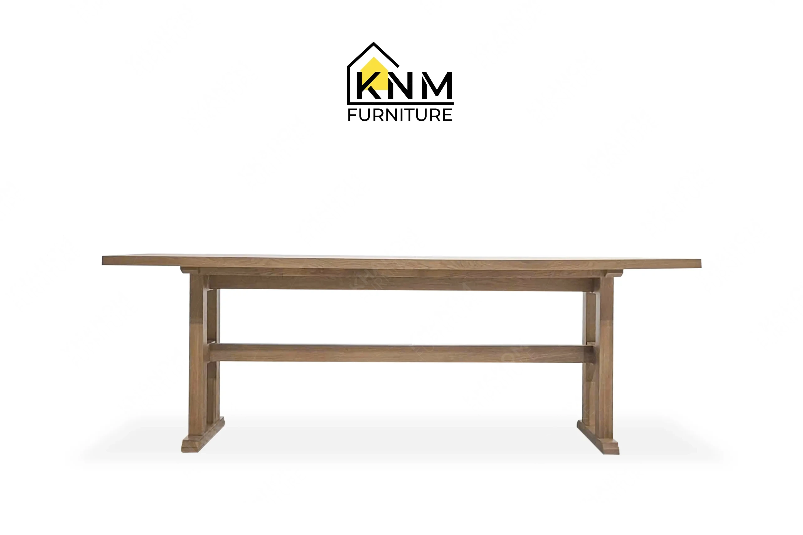 This front view displays the 120-inch solid oak communal table manufactured by Khanom Furniture, highlighting the expansive wood top and trestle base.