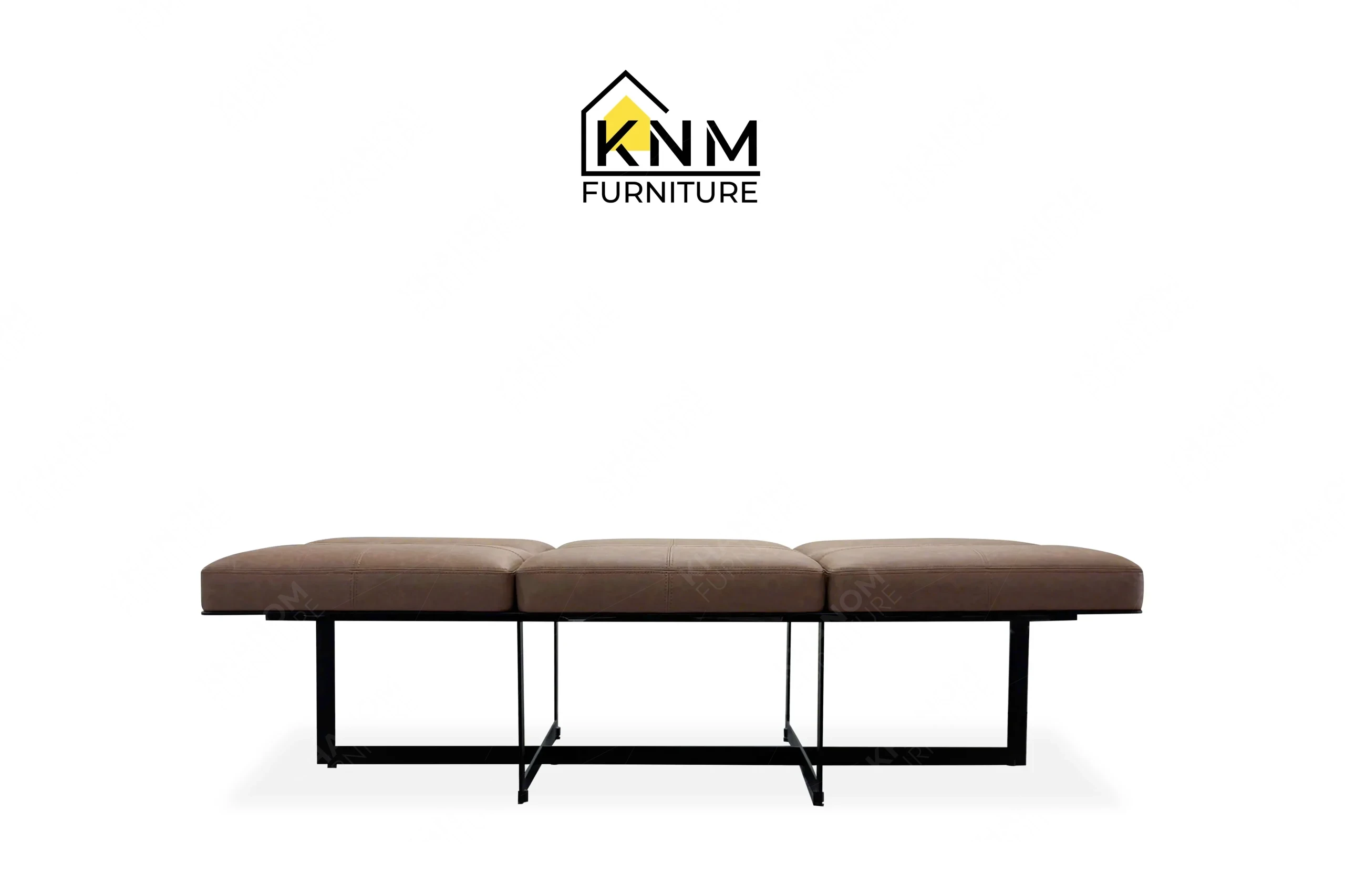 This front view displays the Fabricut upholstered metal locker room bench manufactured by Khanom Furniture, highlighting the multi-panel seat and metal frame.
