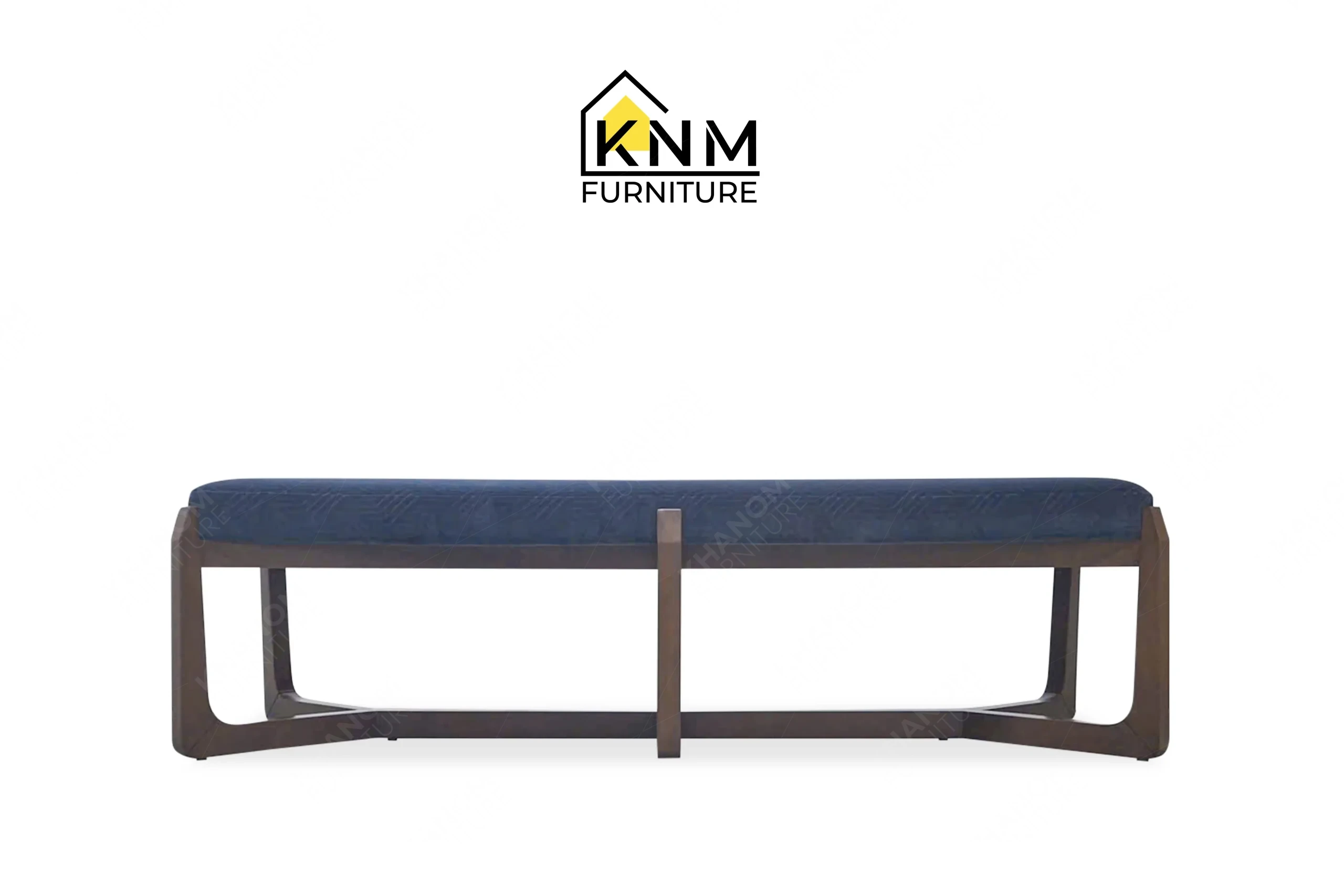 This front view displays the Fabricut upholstered solid Beech dining bench manufactured by Khanom Furniture, highlighting the Prussian blue fabric and geometric wood base.