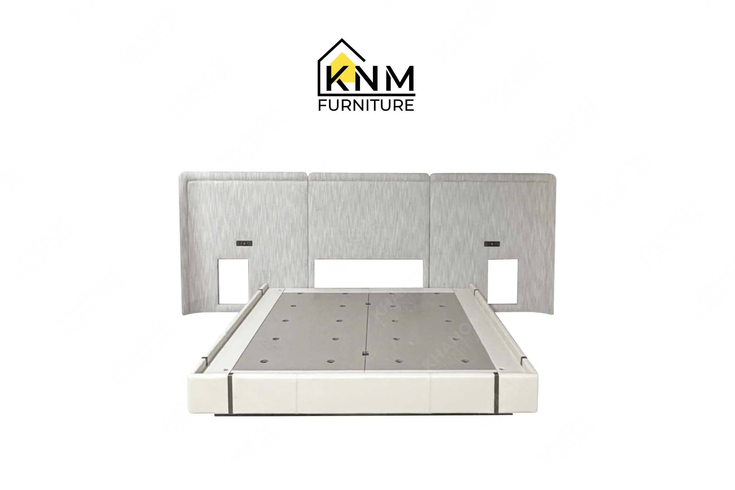 This front view displays the upholstered hotel bed base and headboard manufactured by Khanom Furniture, highlighting the integrated structural panels and precise cutouts.