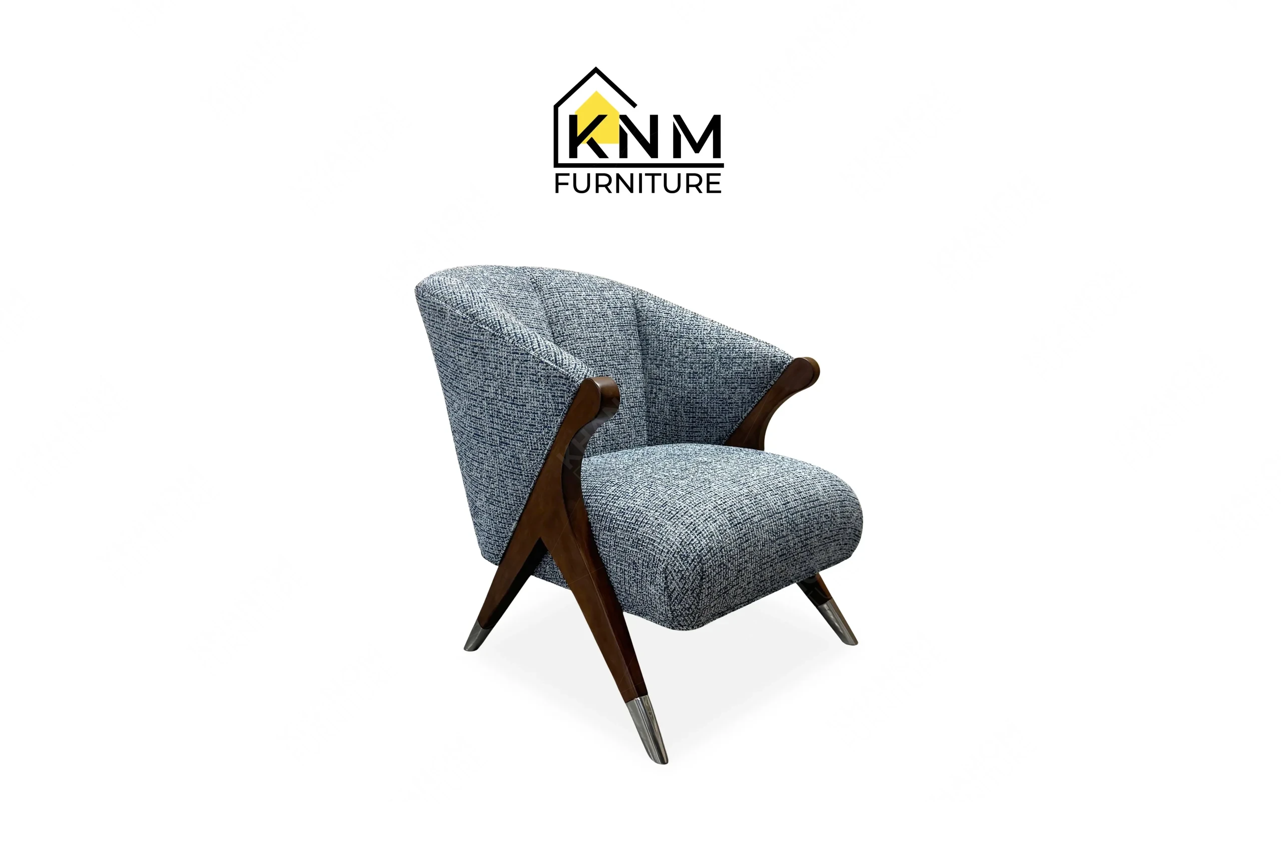 A perspective view illustrating the A-frame hardwood legs and chrome sabots of the Fabricut upholstered hardwood lounge chair produced by Khanom Furniture.