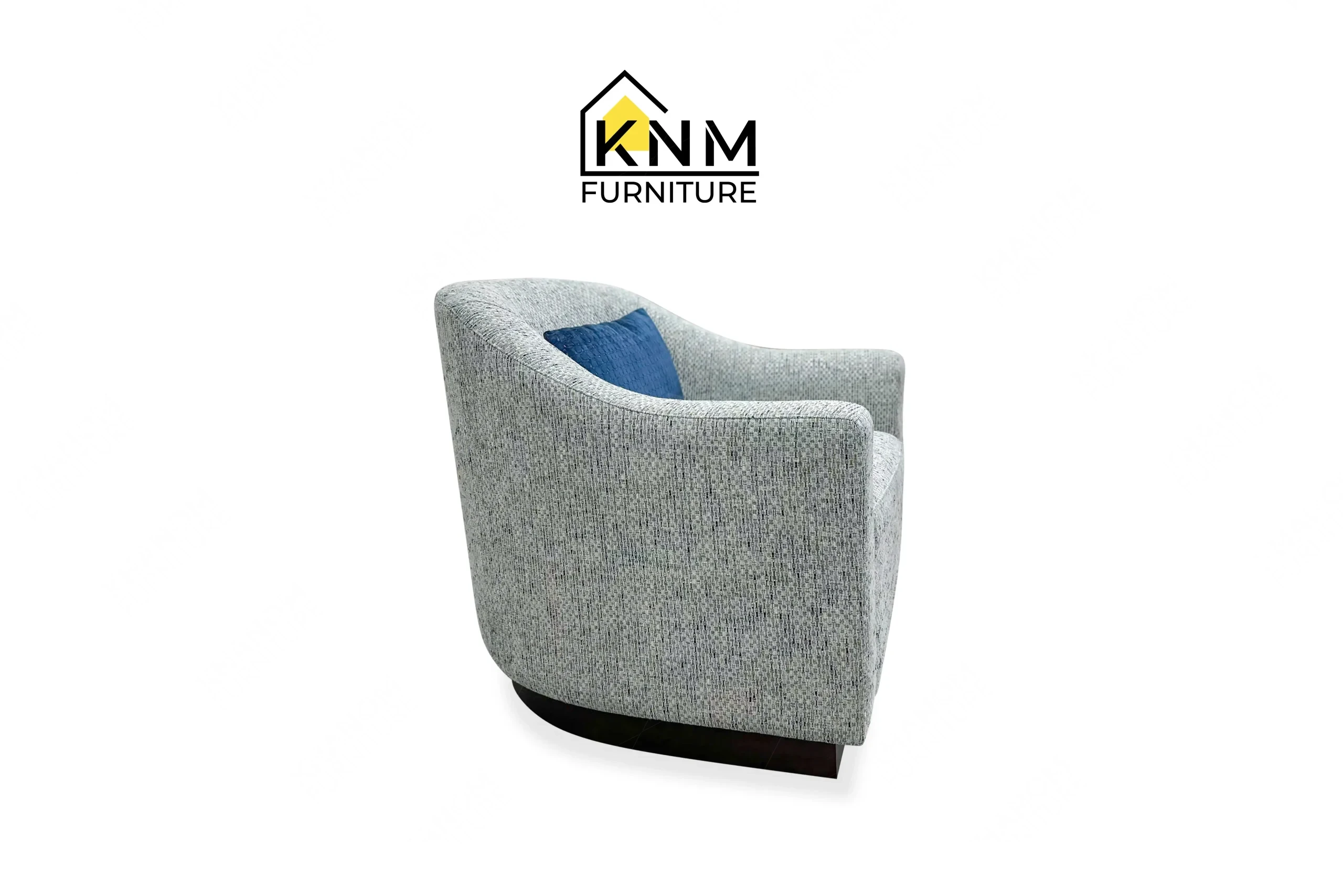 The side profile of the Fabricut upholstered swivel lounge chair highlights the concealed swivel base and pitch specified by Khanom Furniture.