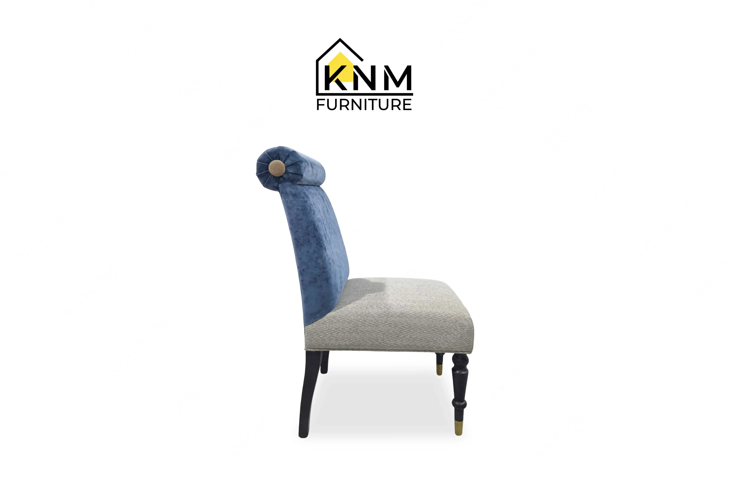 The side profile of the multi-COM rolled back dining chair highlights the splayed back legs and seat pitch specified by Khanom Furniture.