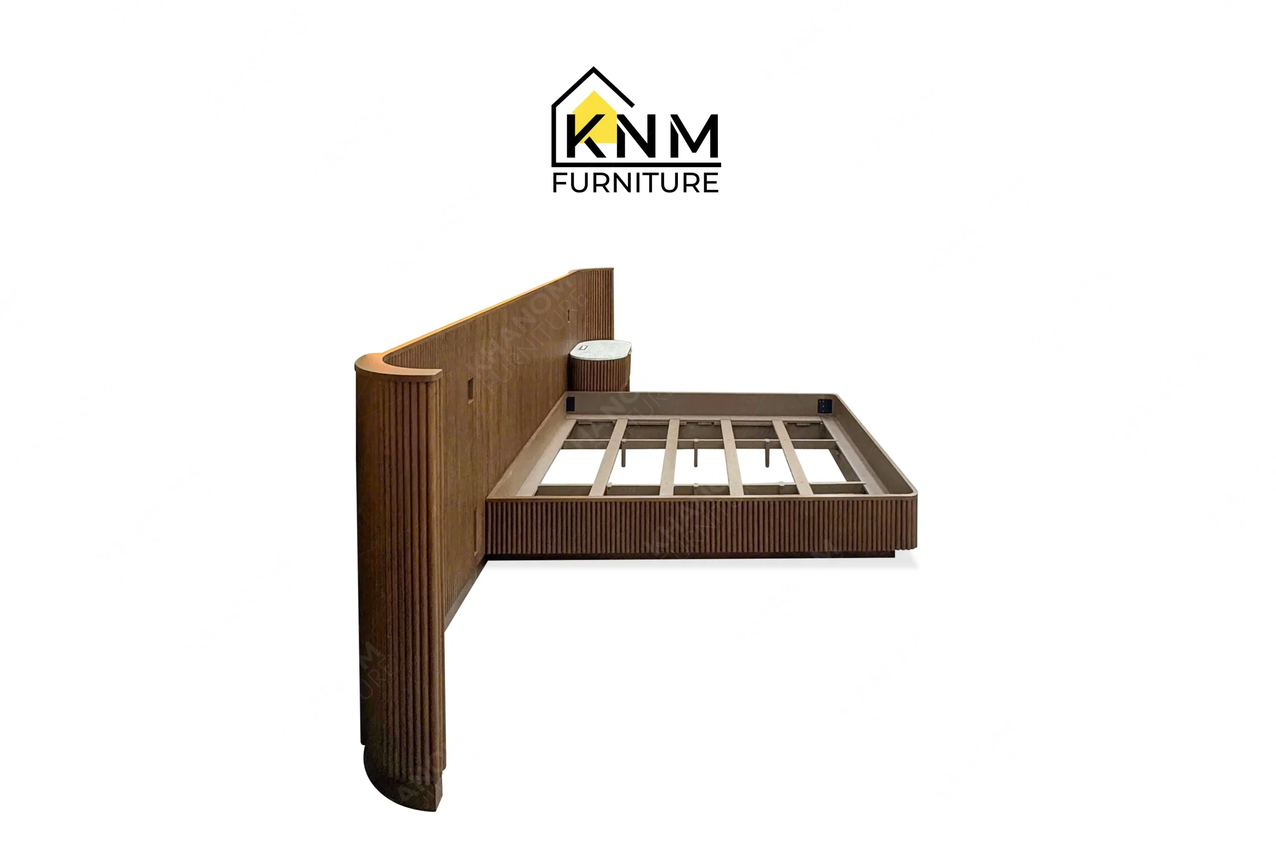This rear view captures the concealed KD hardware and mounting cleats of the fluted hardwood King bed system engineered by Khanom Furniture.