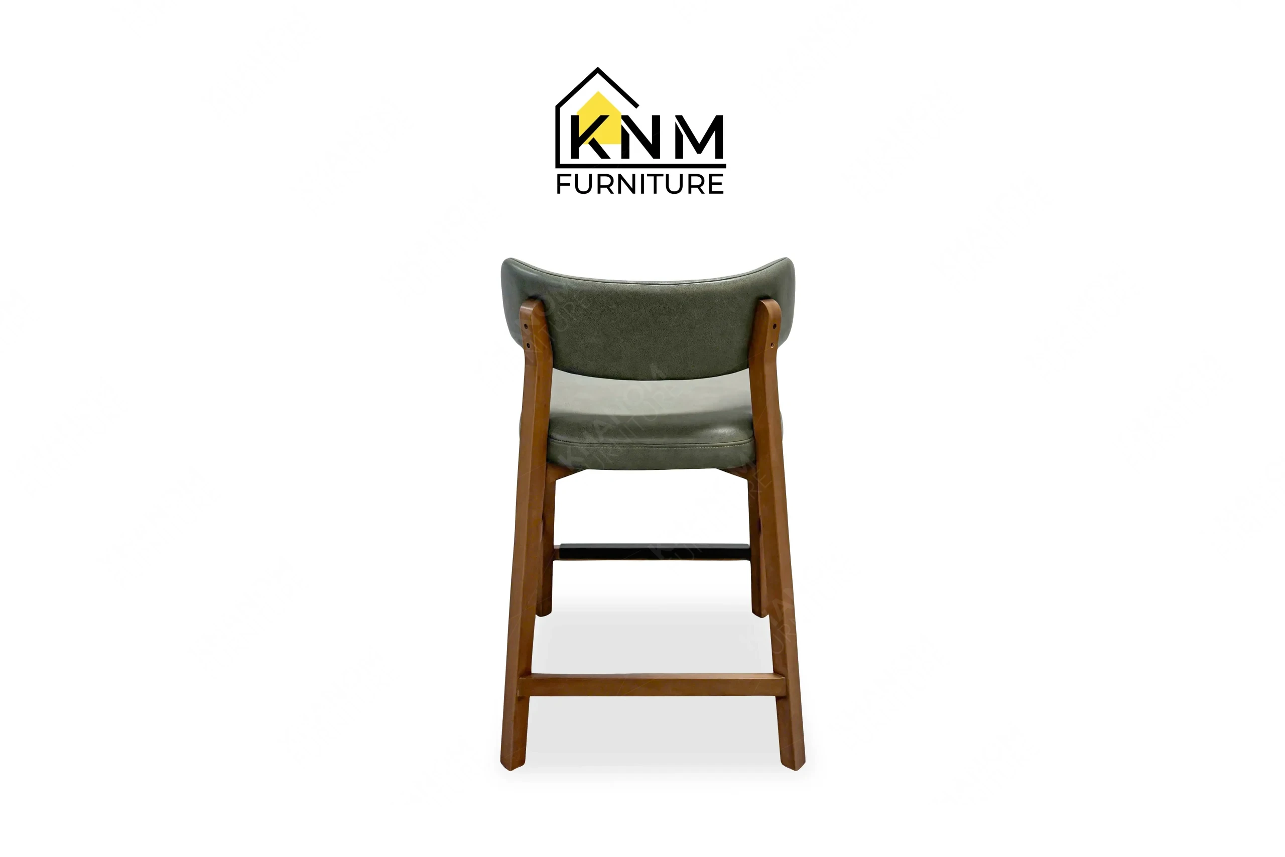This rear view captures the tight back leather upholstery and Italian Walnut finish of the Italian Walnut Maple counter bar stool engineered by Khanom Furniture.