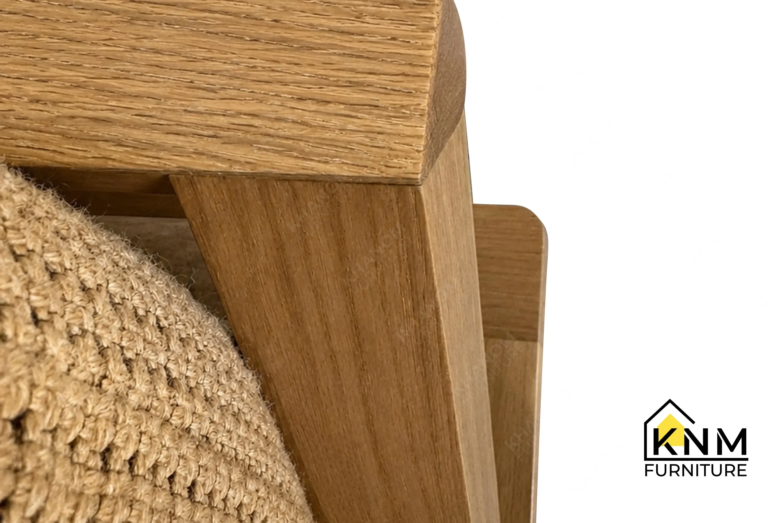 A detailed material zoom of the Multi-COM Solid Oak 144-Inch Lounge Sofa by Khanom Furniture, showing the Architex English Leather seat cushion.