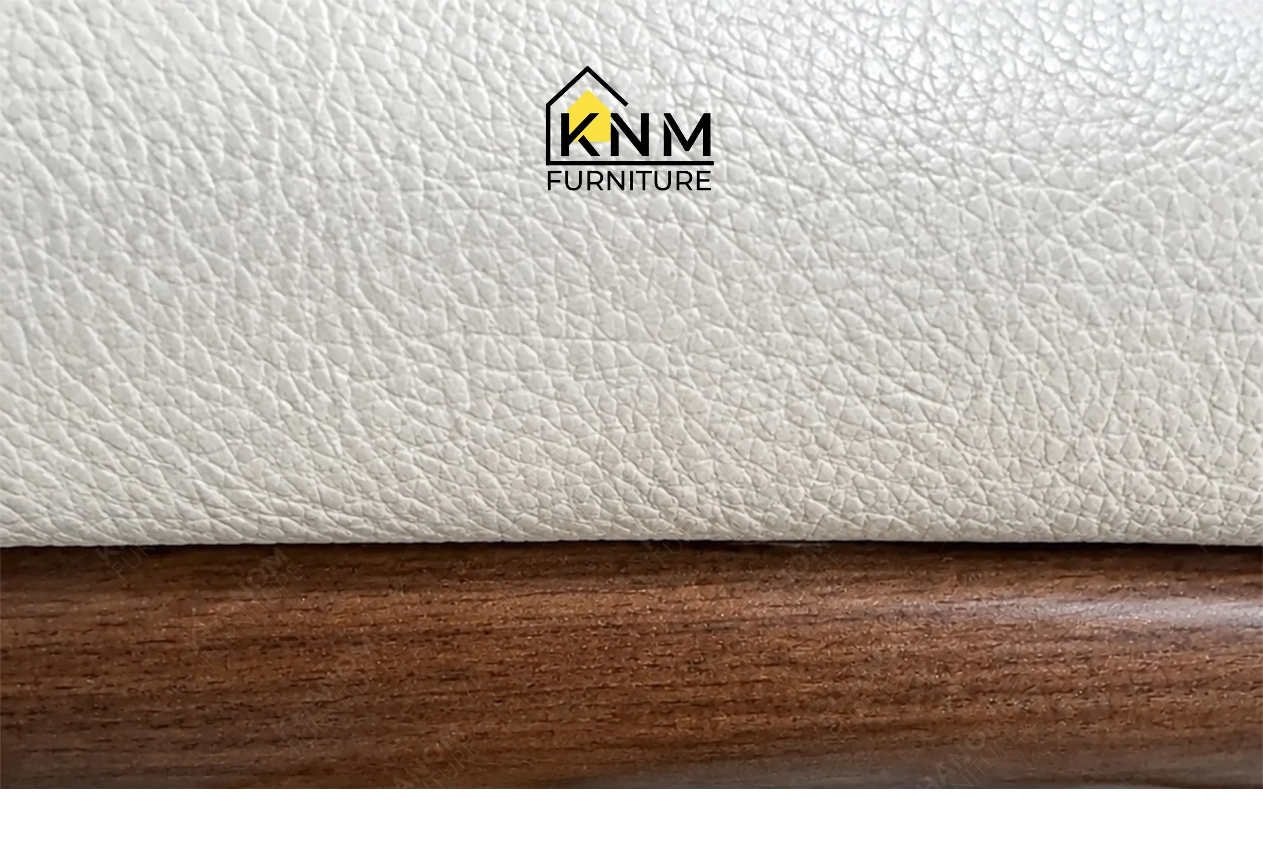 A detailed material zoom of the Ash solid wood upholstered dining chair by Khanom Furniture, showing the texture of the Mayer Bone Caressa vinyl.