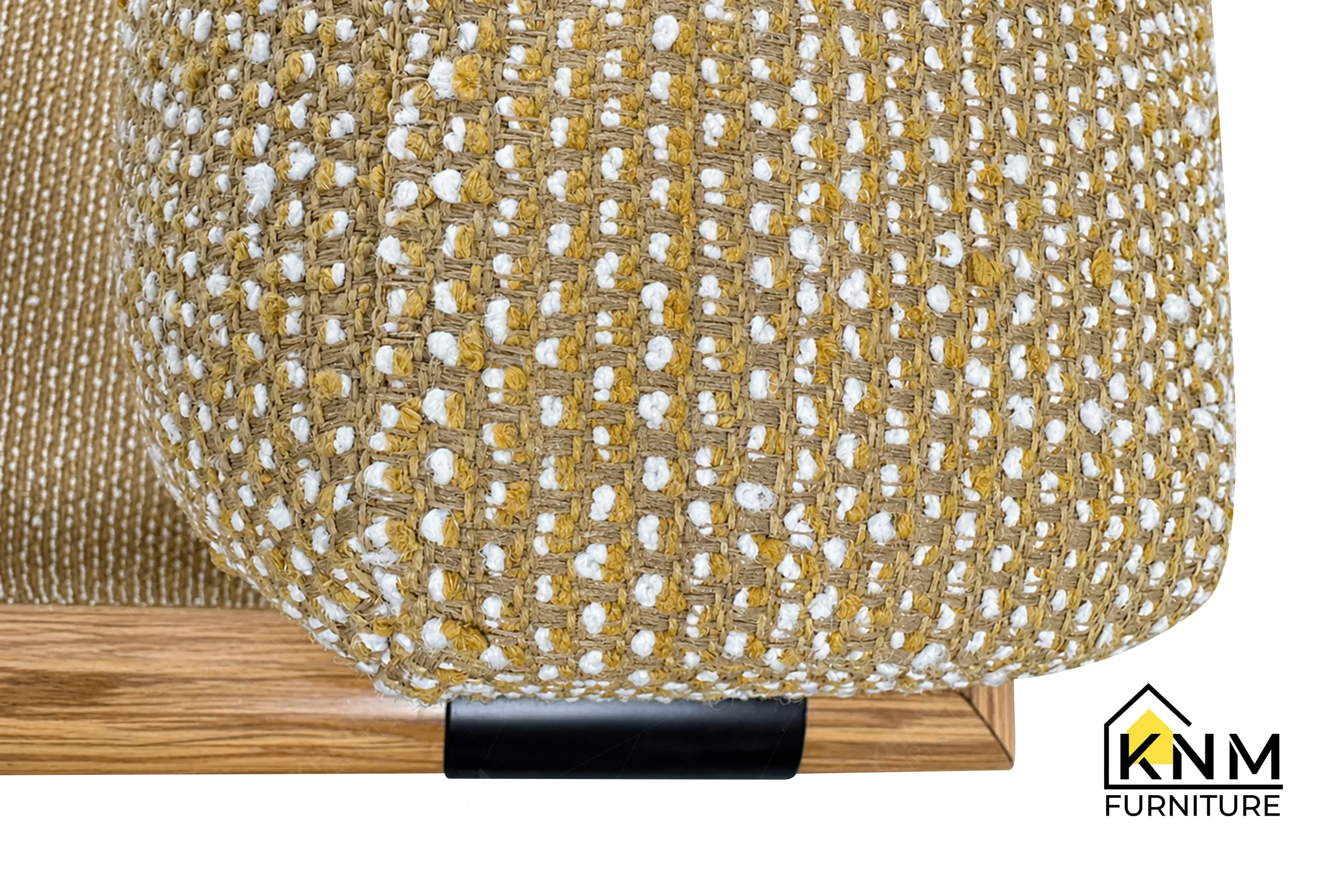 A detailed material zoom of the Mayer upholstered metal oak lounge chair by Khanom Furniture, showing the texture of the Mayer commercial fabric.