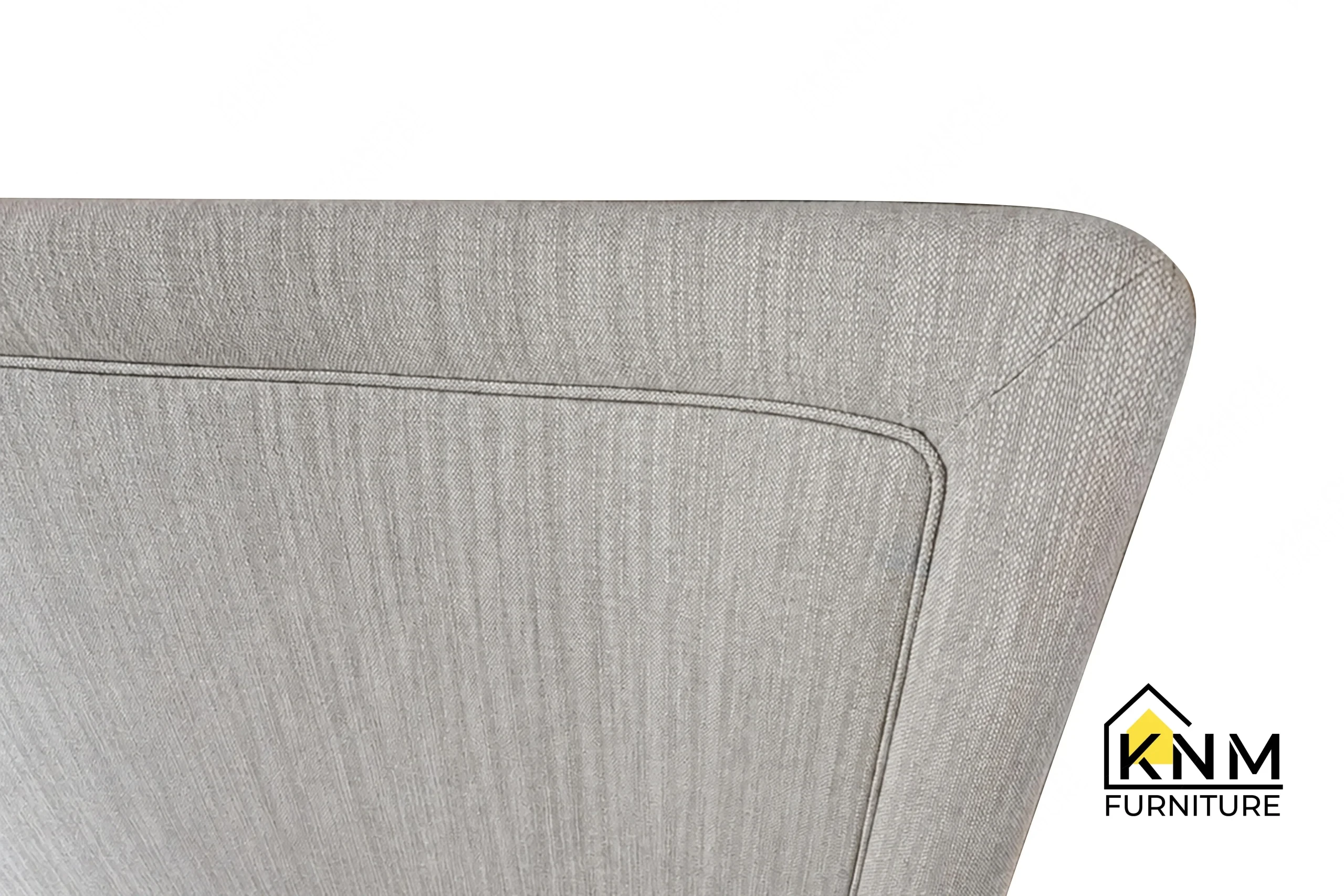 The surface texture detail of the upholstered hotel bed base and headboard manufactured by Khanom Furniture reveals the ventilated mattress support platform.