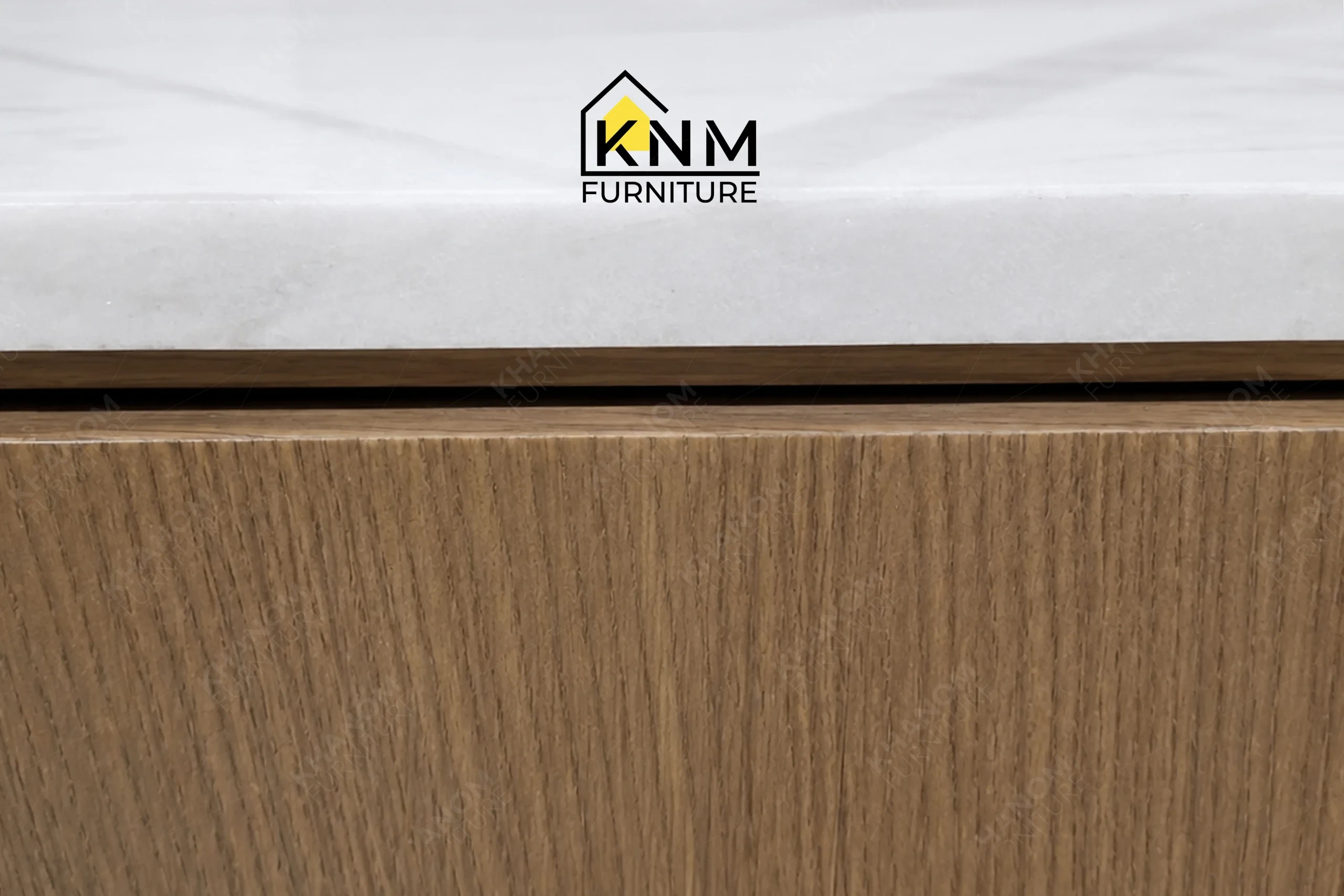 A detailed material zoom of the Bianco Rhino marble TV console by Khanom Furniture, showing the Stoneguard protected marble surface.