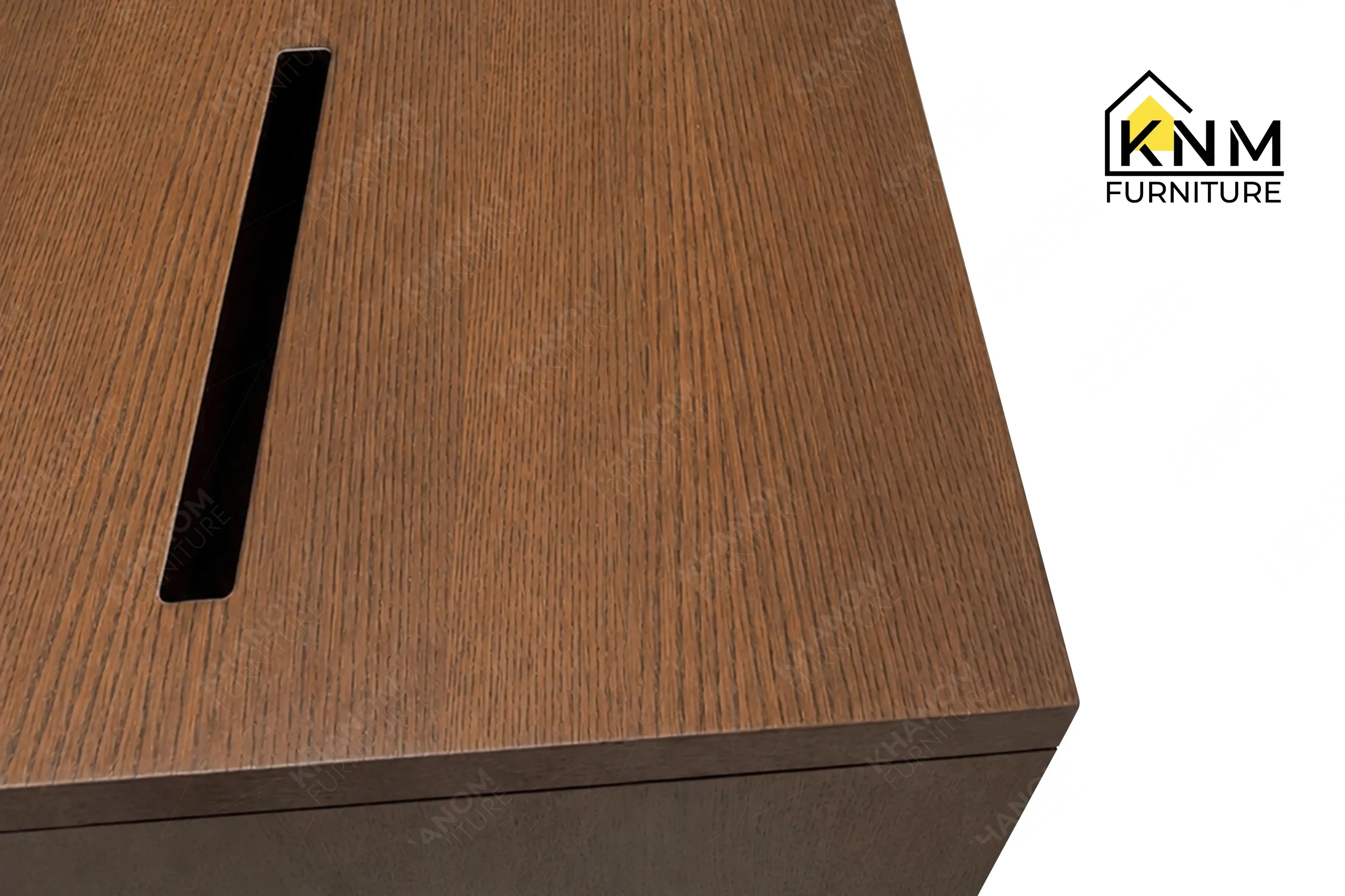 The surface texture detail of the Walnut Quarter Cut Oak Executive Desk manufactured by Khanom Furniture reveals the engineered ventilation slots in the toe kick.